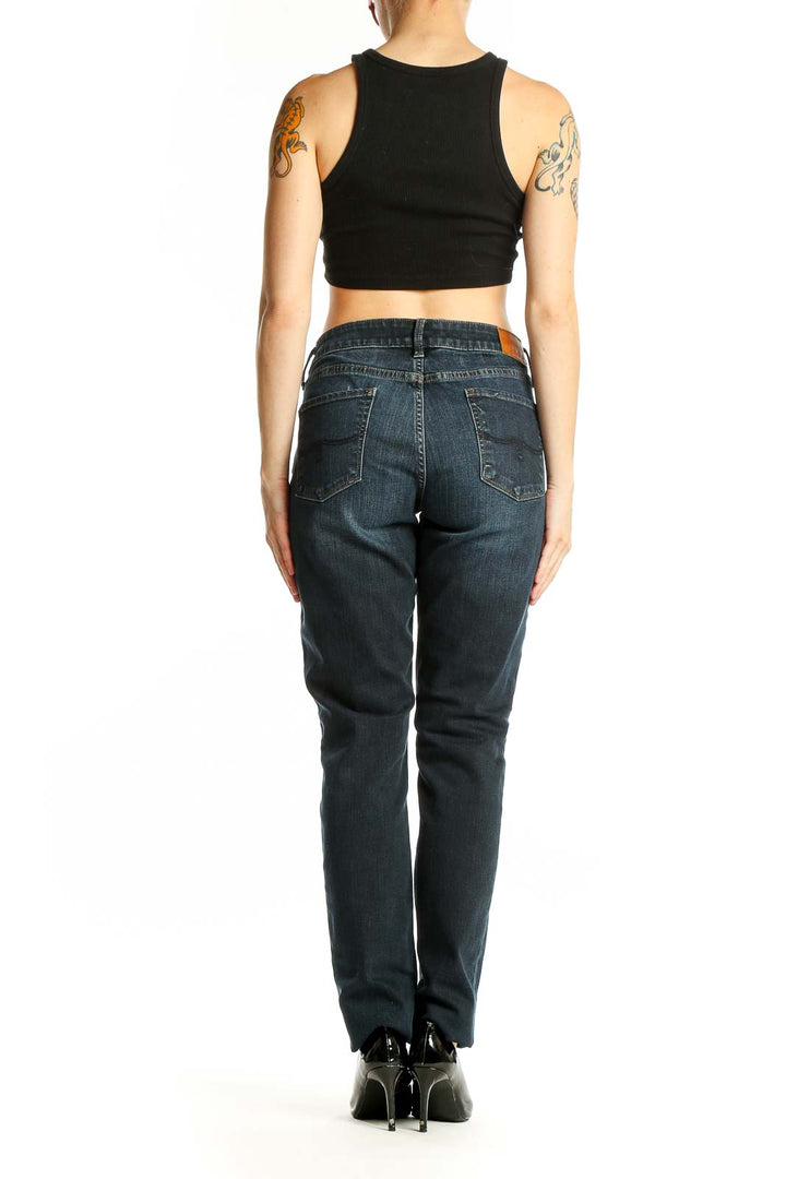 Back view of Lucky Brand dark blue straight leg jeans on model
