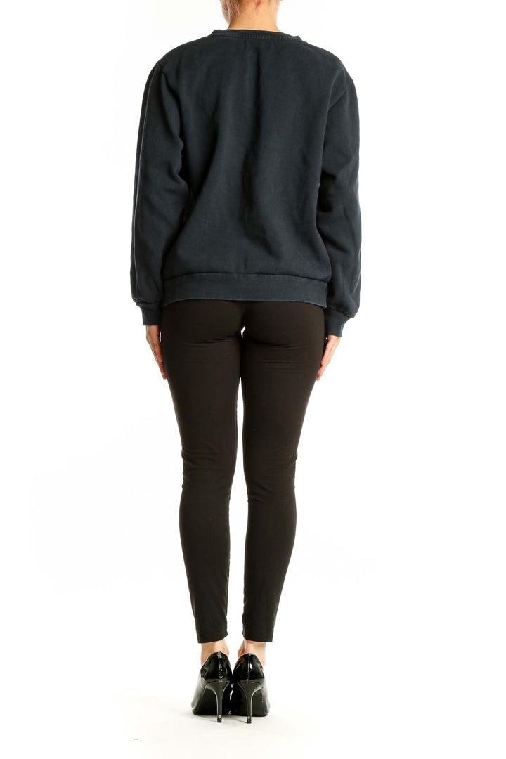 Back view of Rouje Paris black cotton crewneck sweatshirt on model