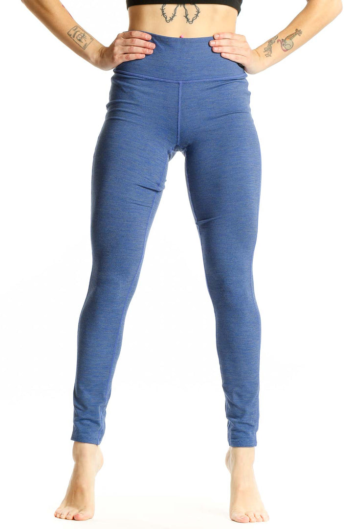 Front view of blue Athleta high-waisted performance leggings