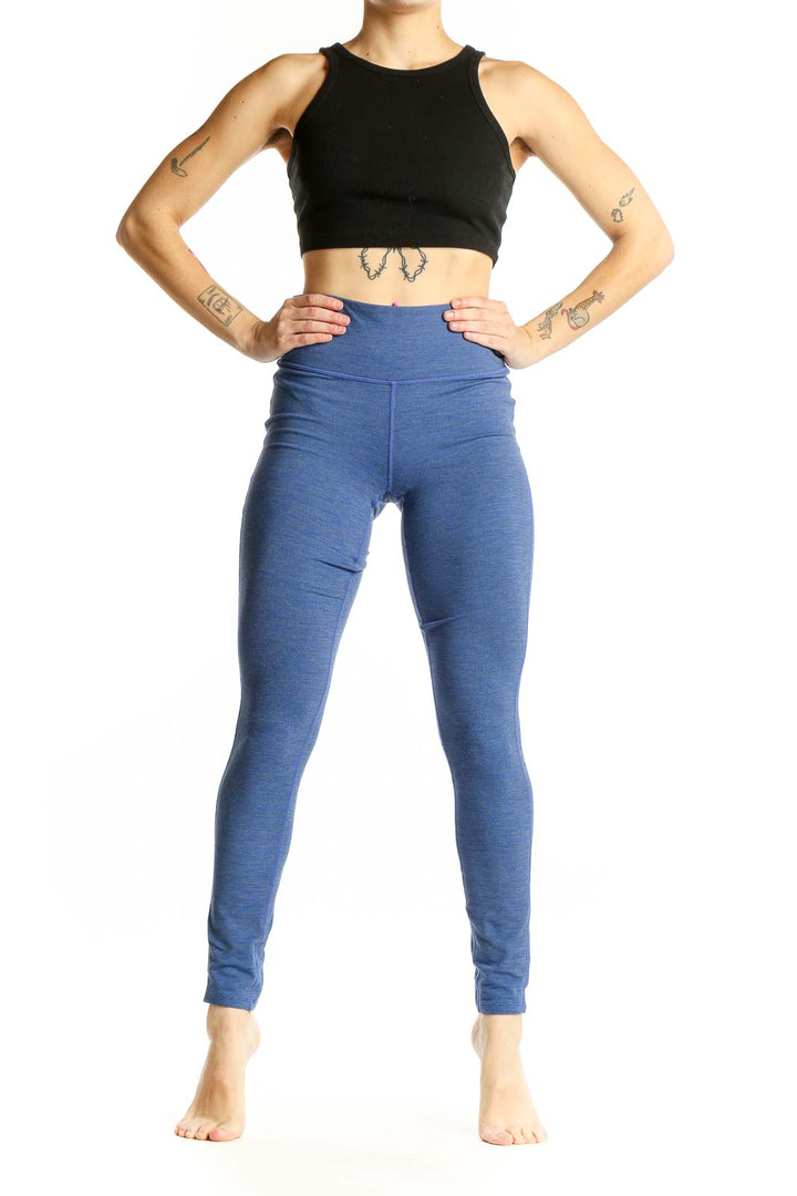 Front view of blue Athleta high-waisted performance leggings
