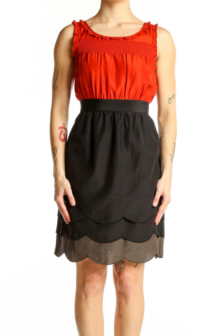 Front view of Maeve red silk dress with ruched bodice and scalloped skirt