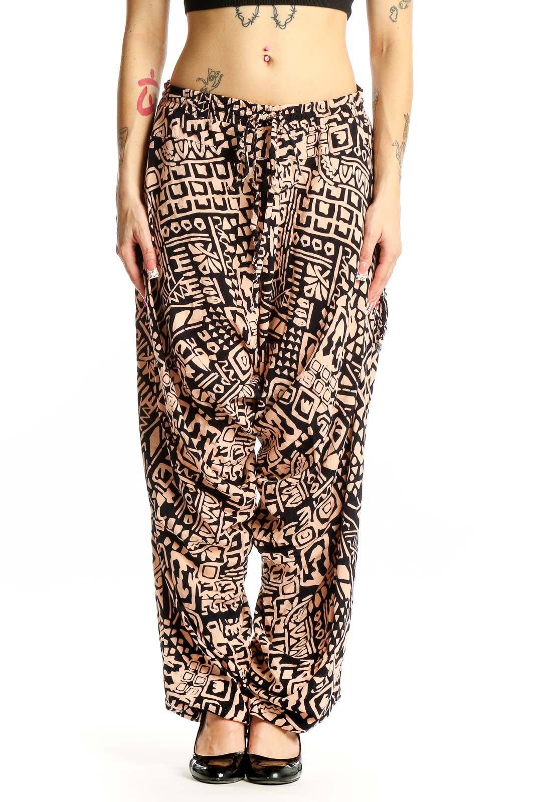 Front view of black and tan geometric print wide-leg pants by Buddha Pants