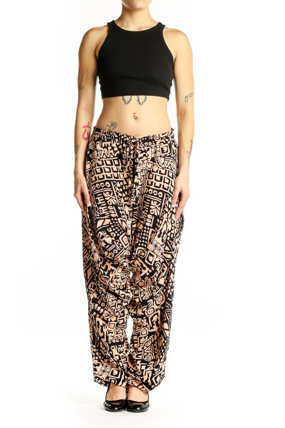 Front view of black and tan geometric print wide-leg pants by Buddha Pants
