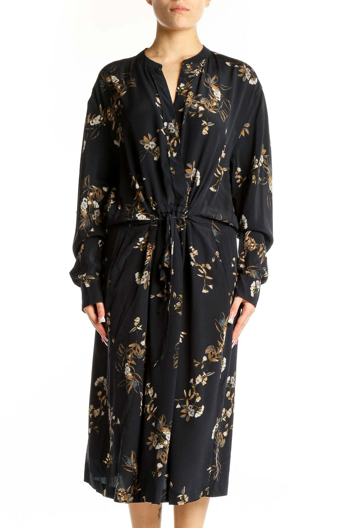 Front view of Vince black silk midi dress with gold floral print and tie waist