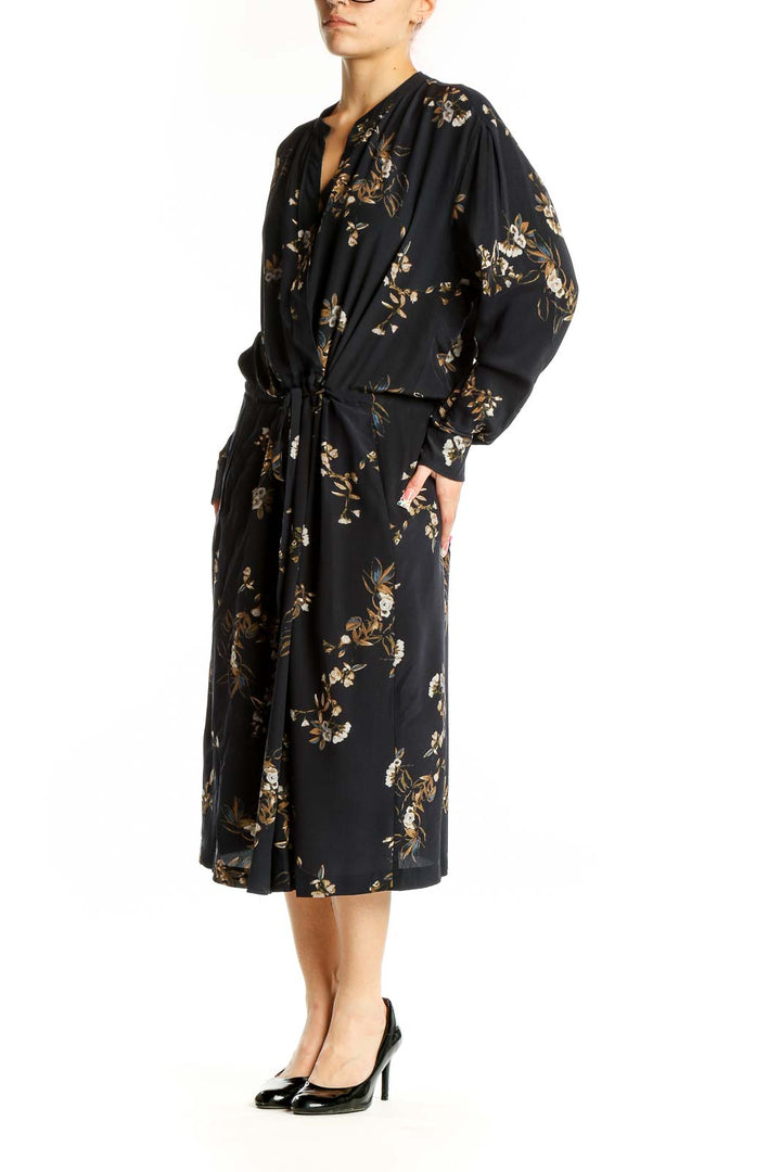 Front view of Vince black silk midi dress with gold floral print and tie waist