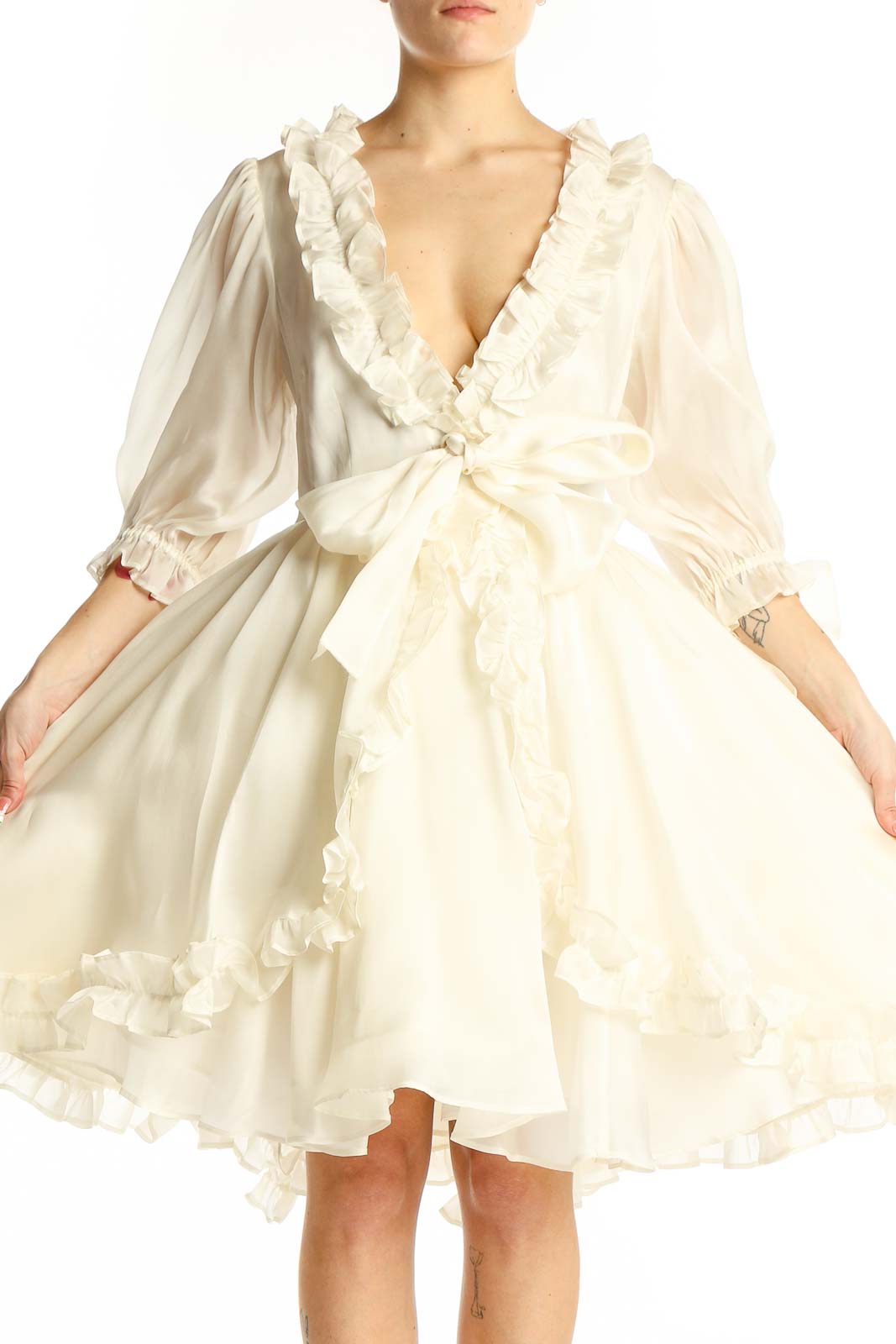Front view of Selkie Collection ivory silk wrap dress with ruffled neckline and voluminous sleeves
