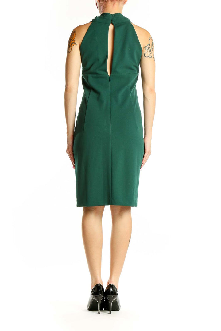 Back view of Eliza J green halter neck cocktail dress