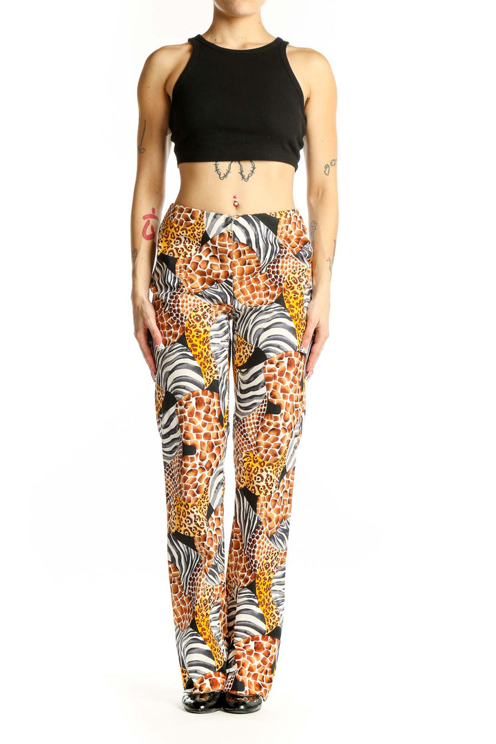 Front view of Cache animal print wide-leg pants with giraffe, leopard, and zebra patterns