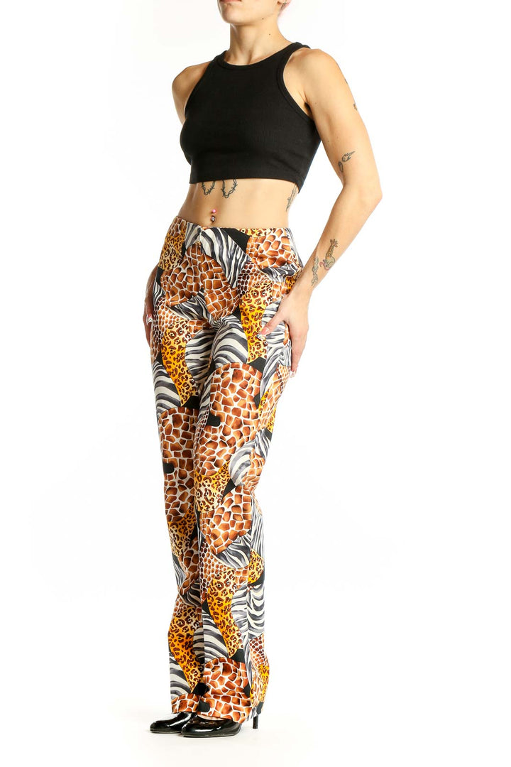 Front view of Cache animal print wide-leg pants with giraffe, leopard, and zebra patterns