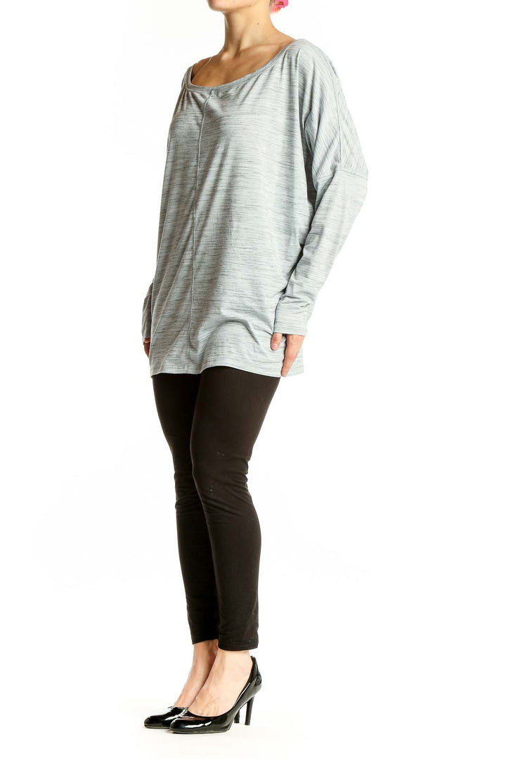 Front view of light gray oversized Athleta activewear top