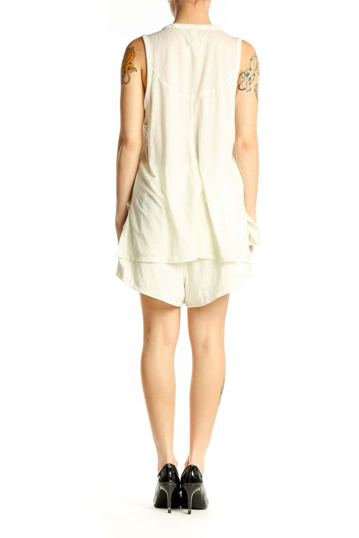 Side view of white sleeveless Lululemon athletic dress on model