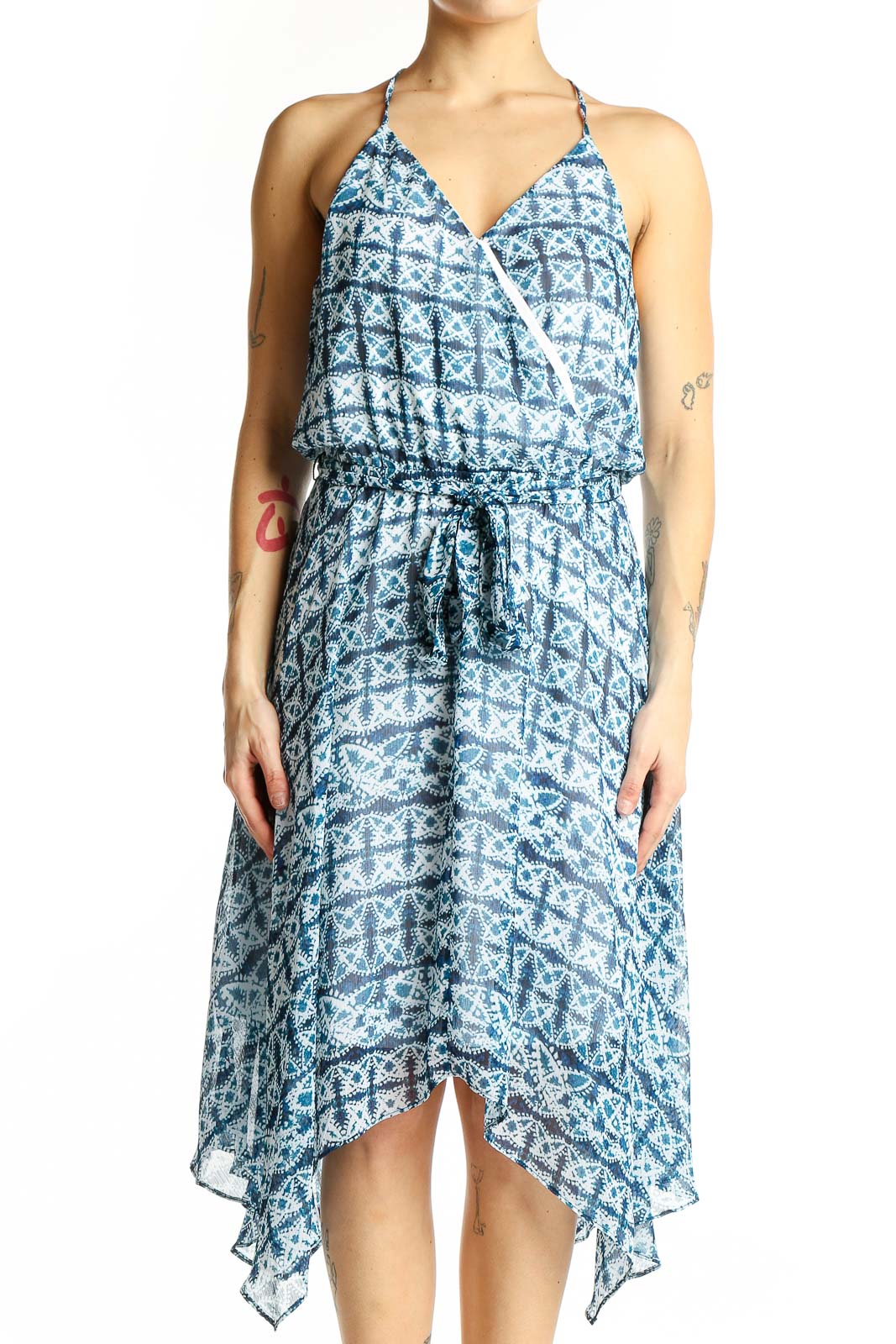 Front view of blue geometric print halter dress with wrap-style bodice
