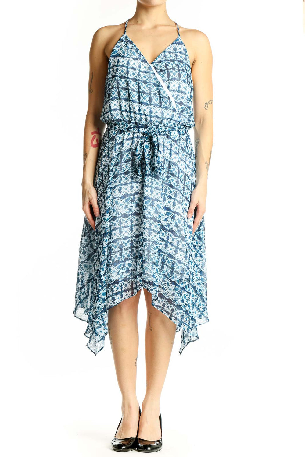 Front view of blue geometric print halter dress with wrap-style bodice