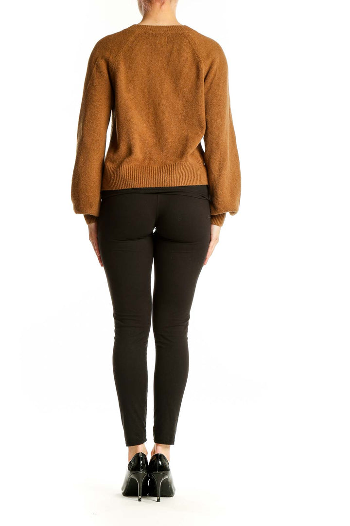 Back view of camel Gap cardigan showing relaxed fit and balloon sleeves