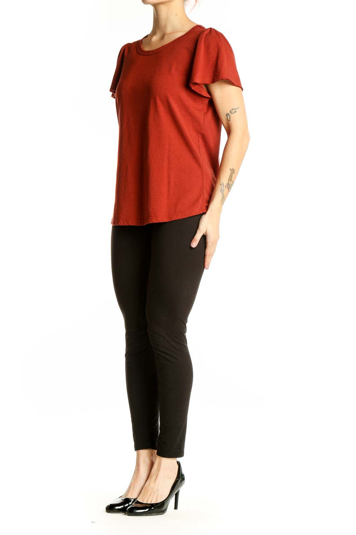 Front view of rust-colored Philosophy flutter sleeve top