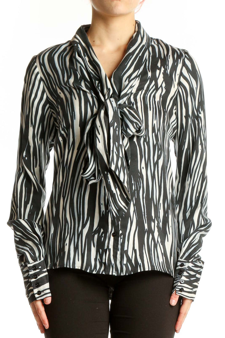 Front view of Rachel Zoe black and white zebra print silk blouse with tie-neck