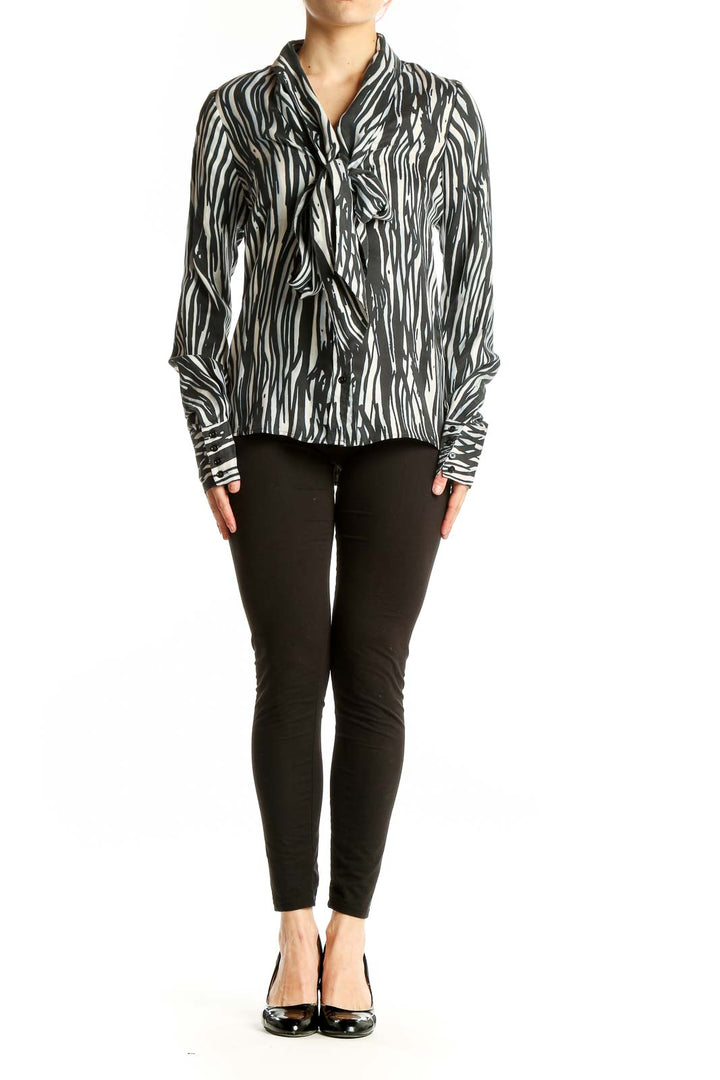 Front view of Rachel Zoe black and white zebra print silk blouse with tie-neck