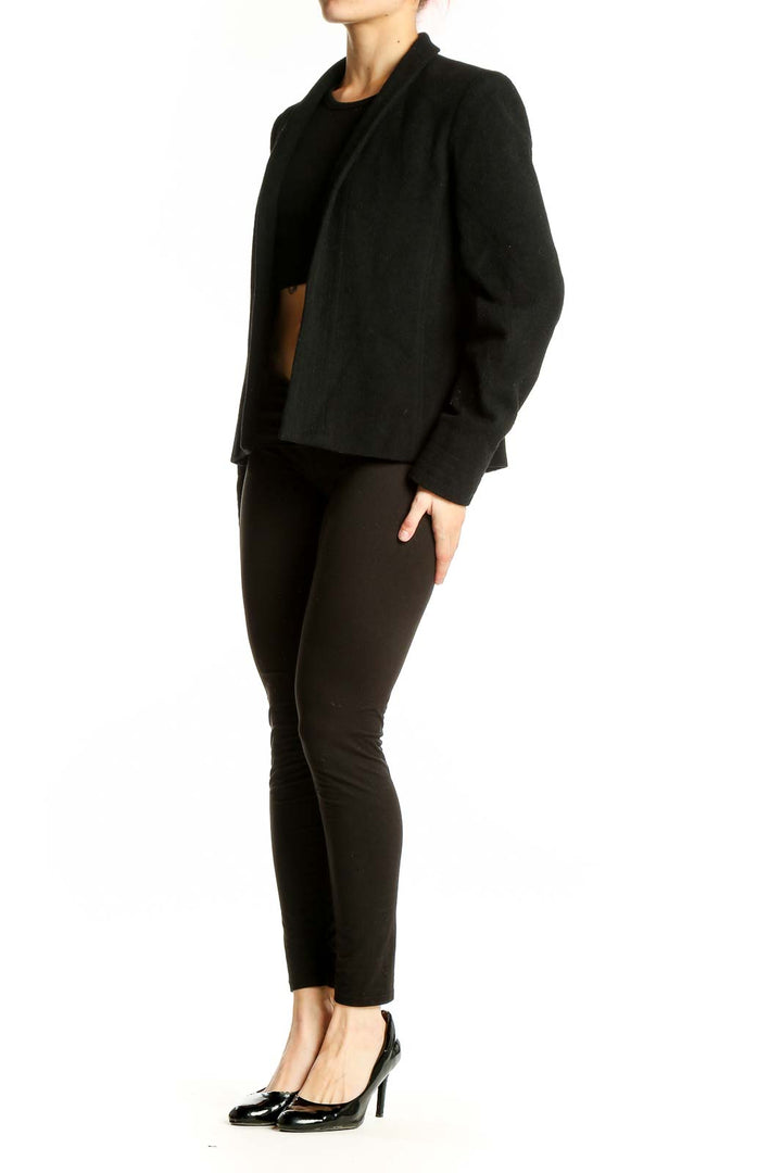 Front view of black Louben open-front blazer on model