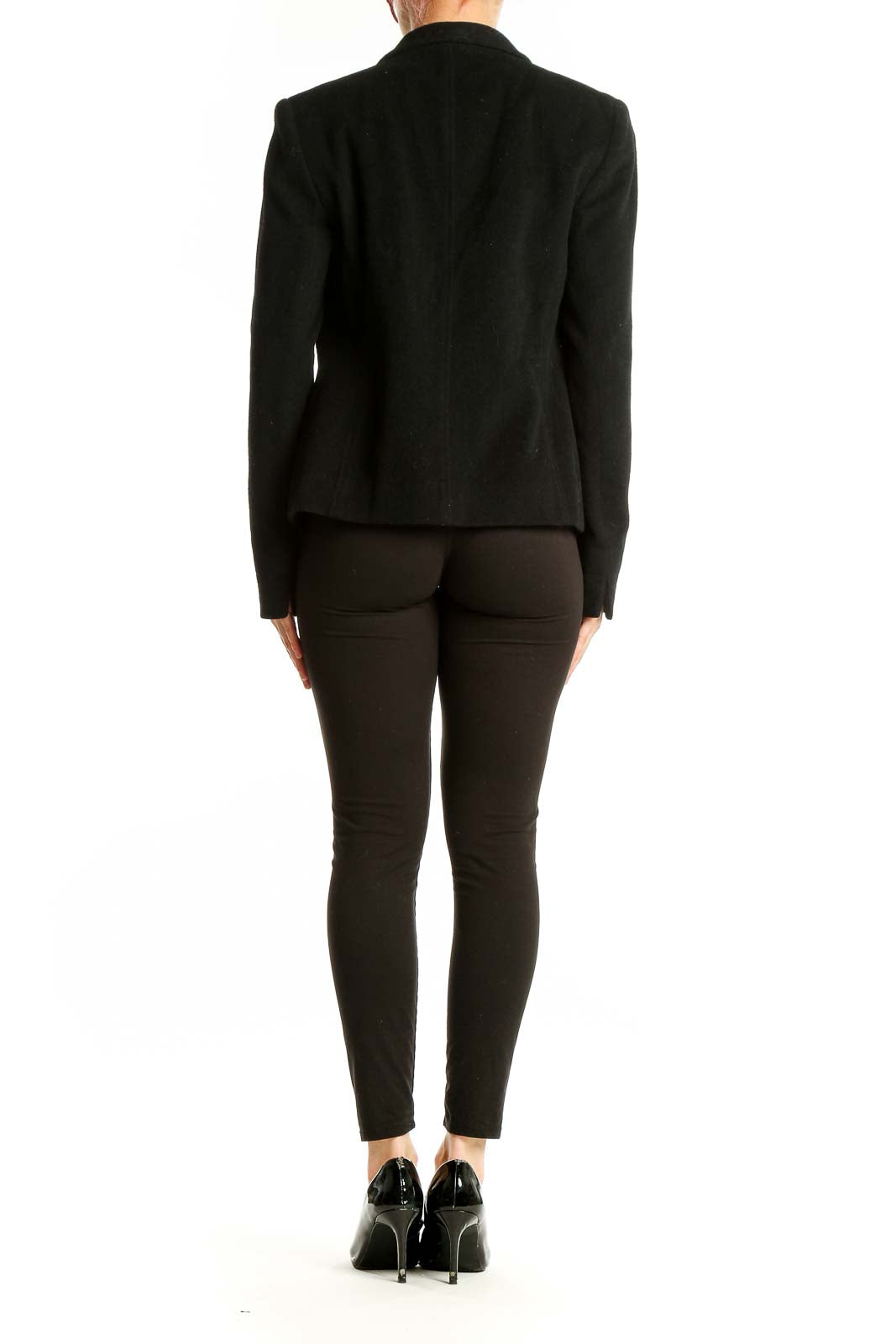 Back view of black Louben open-front blazer on model with full outfit