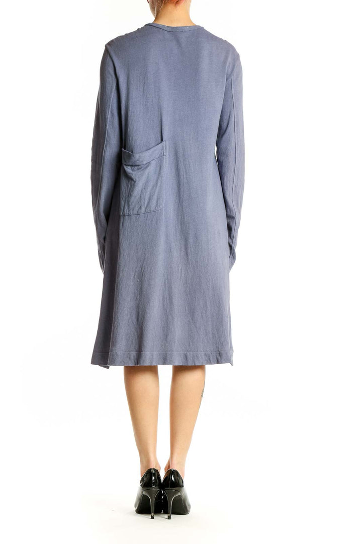 Side view of WILT blue cotton button-up cardigan dress showing relaxed fit