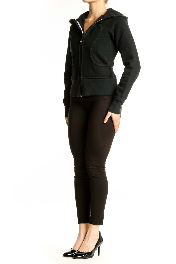 Front view of black Lululemon zip-up hooded athletic jacket