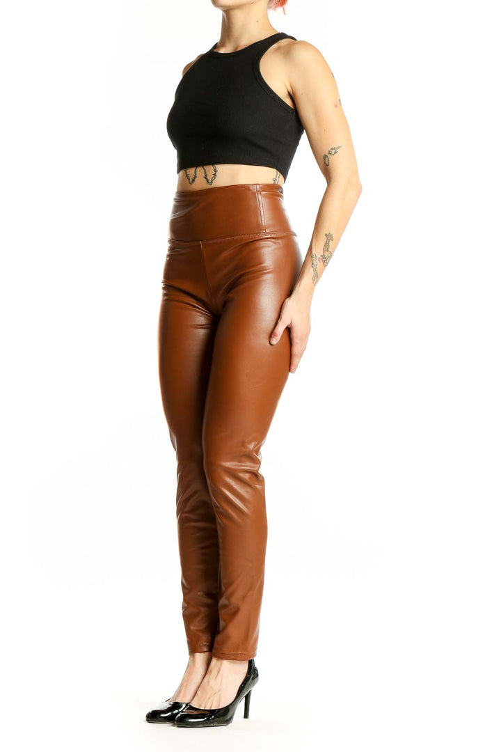 Front view of Bagatelle brown high-waisted faux leather leggings