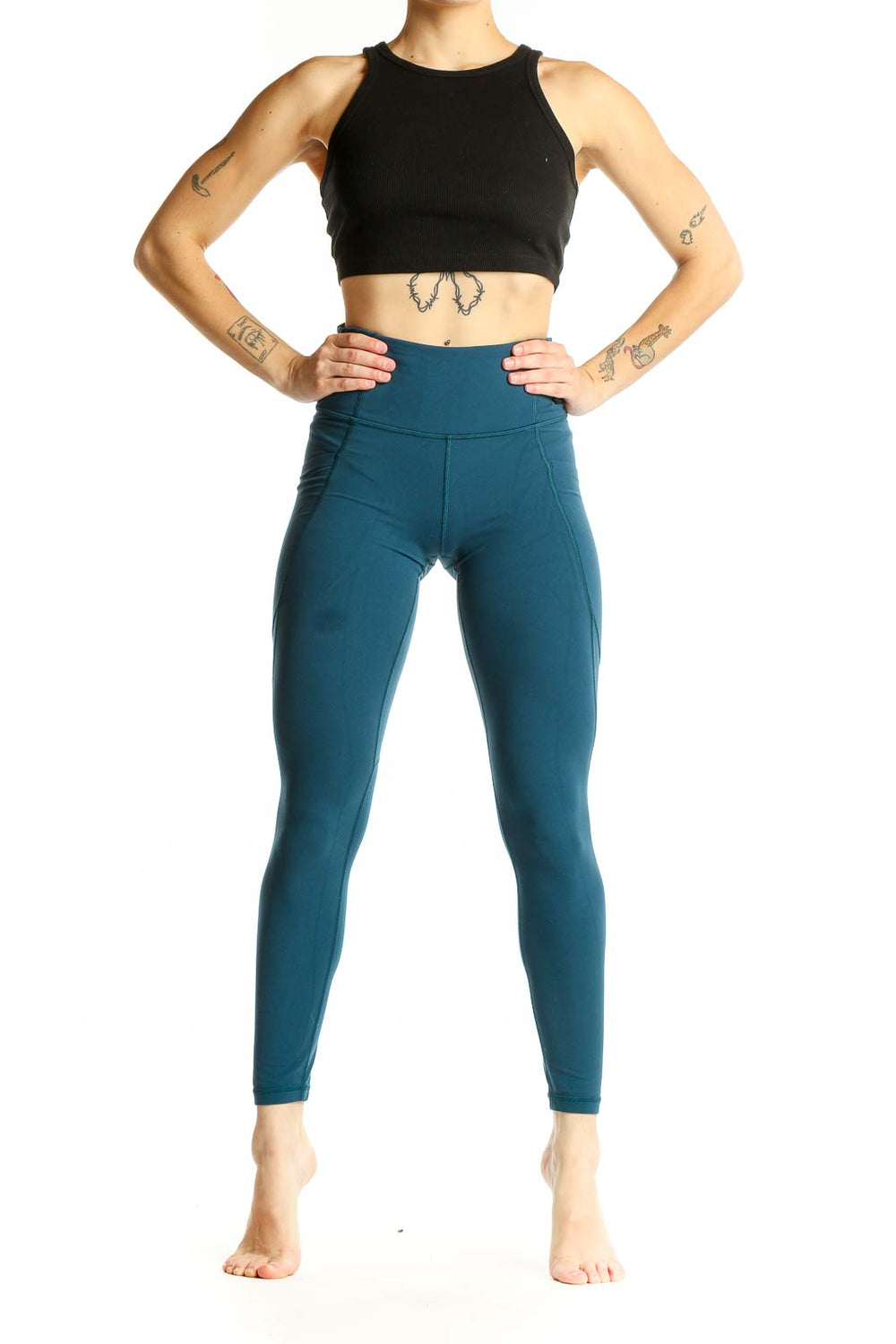 Front view of teal Athleta high-waisted performance leggings