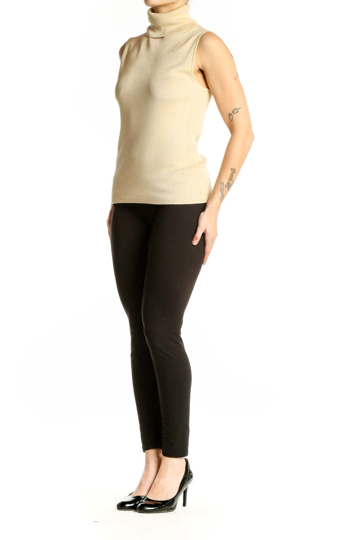 Front view of Ann Taylor cream sleeveless turtleneck knit top