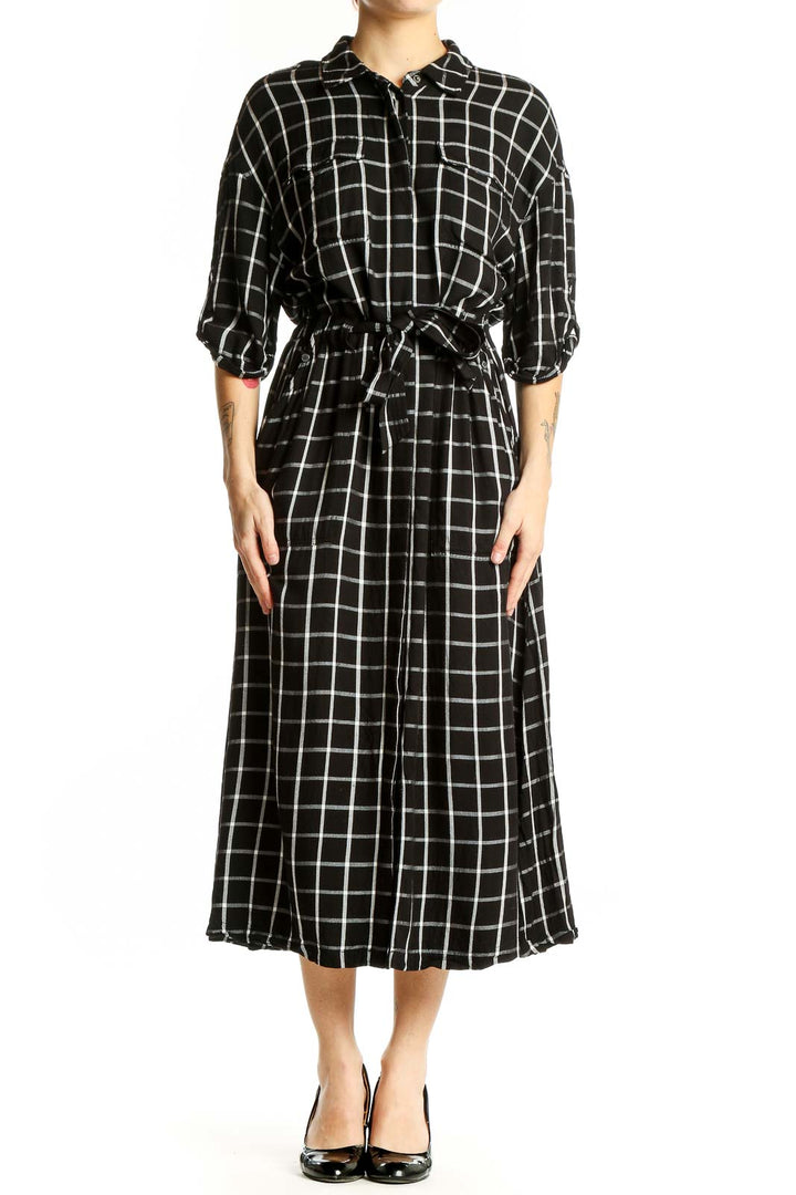 Front view of Calvin Klein black and white plaid midi shirt dress with belt