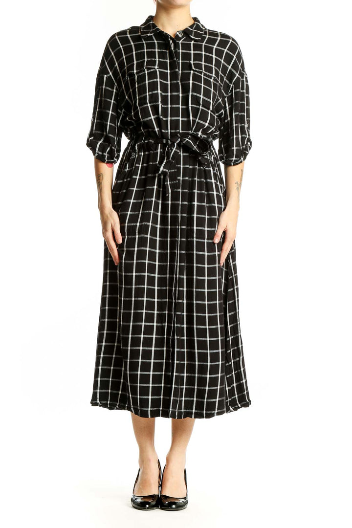 Front view of Calvin Klein black and white plaid midi shirt dress with belt