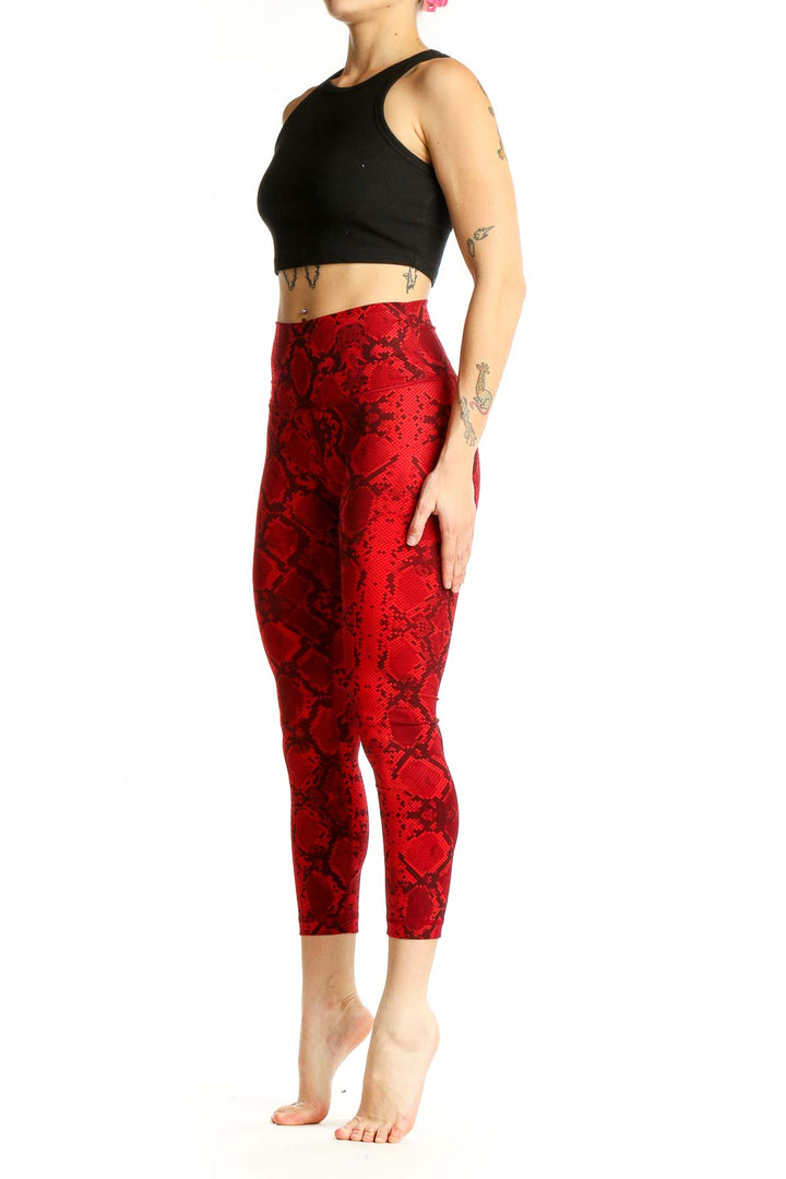 Front view of red snake print Lululemon cropped leggings
