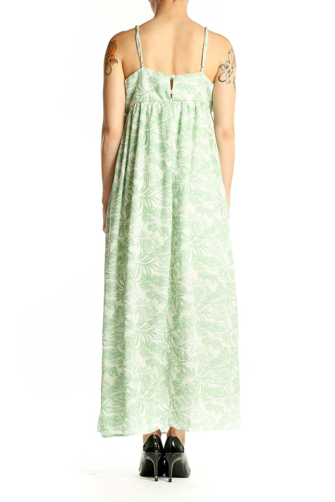 Side view of mint green Gilli maxi dress showing empire waist and full-length skirt
