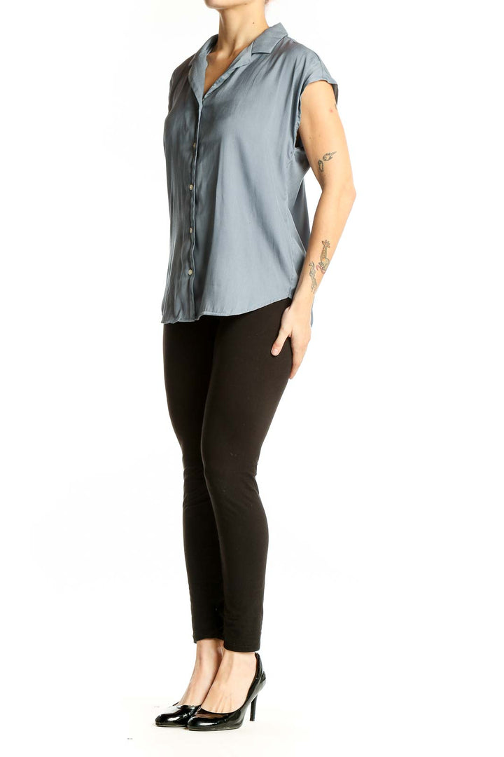 Front view of T Tahari blue polyester short-sleeve button-up blouse