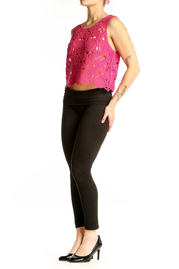 Front view of hot pink crochet lace crop top with floral pattern