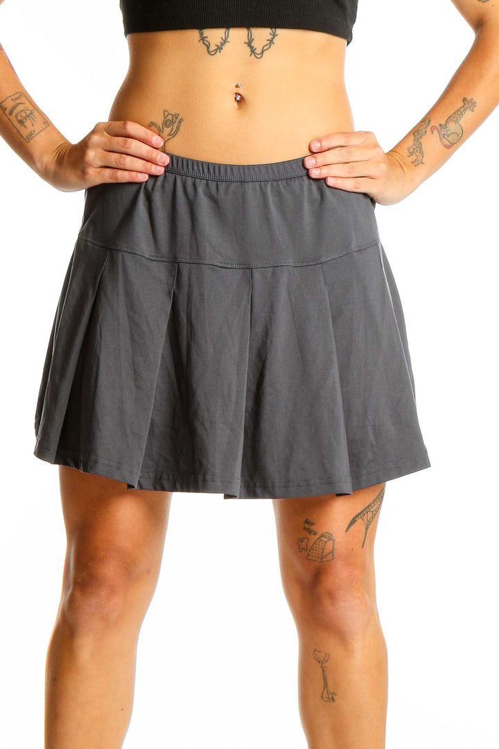 Front view of gray pleated athletic skirt by Bollé