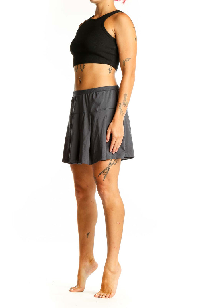 Front view of gray pleated athletic skirt by Bollé