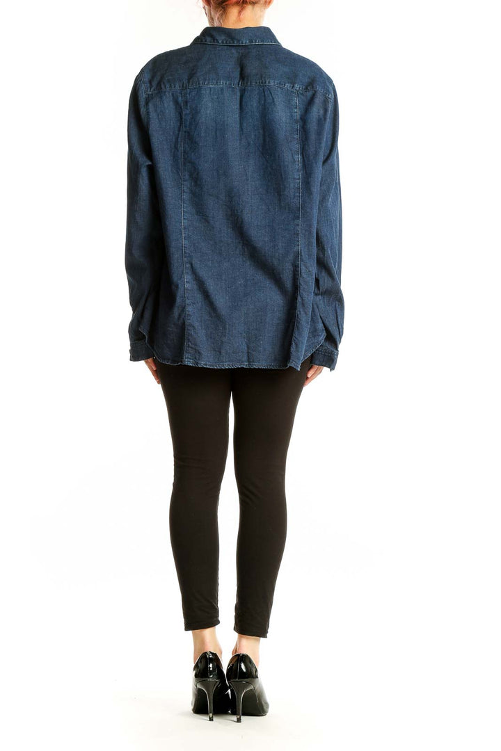 Back view of J.Jill blue denim button-up shirt on model