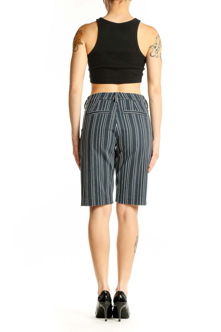 Side view of woman wearing gray striped Bermuda shorts by Liverpool Los Angeles
