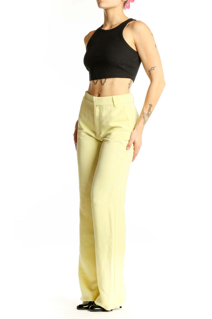 Front view of Zara yellow wide-leg trousers on model