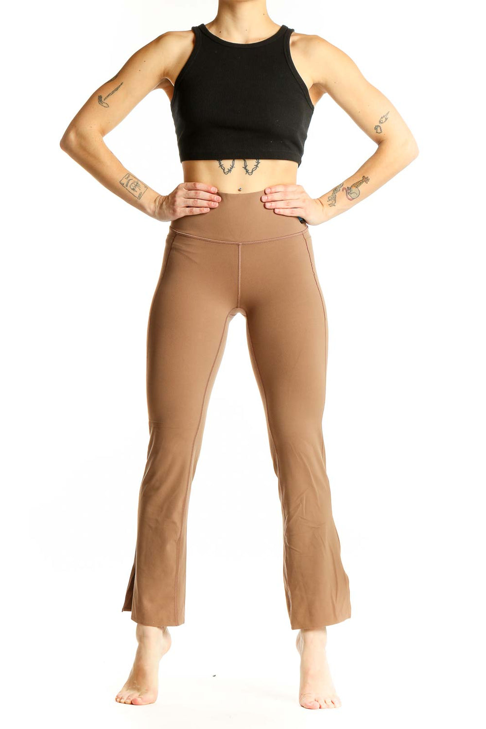Front view of tan high-waisted flare yoga pants from Athleta