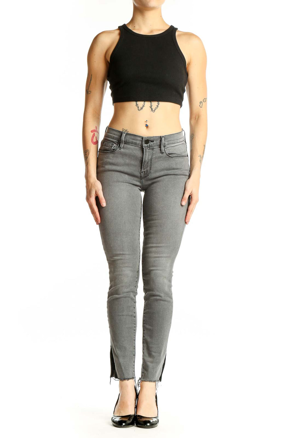 Front view of gray FRAME Denim skinny jeans with ankle slits