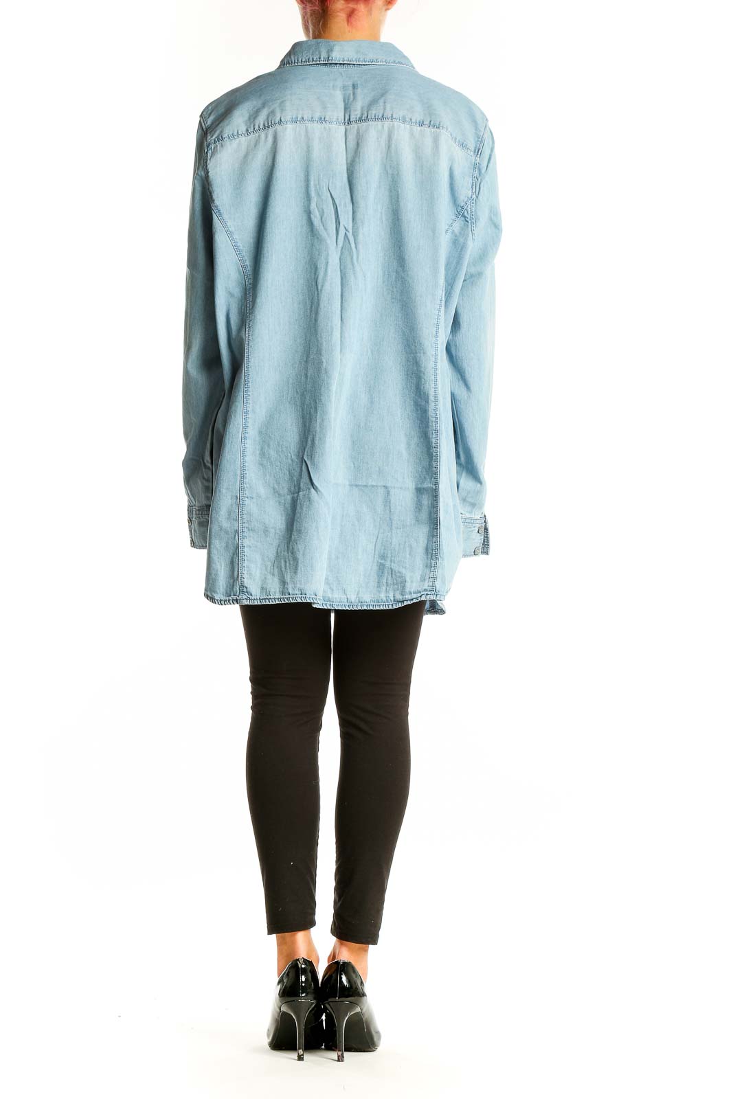 Side view of model wearing J.Jill light blue oversized cotton button-down shirt with black pants