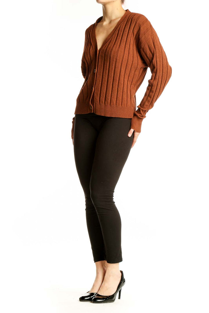 Front view of Sita Murt rust ribbed V-neck cardigan