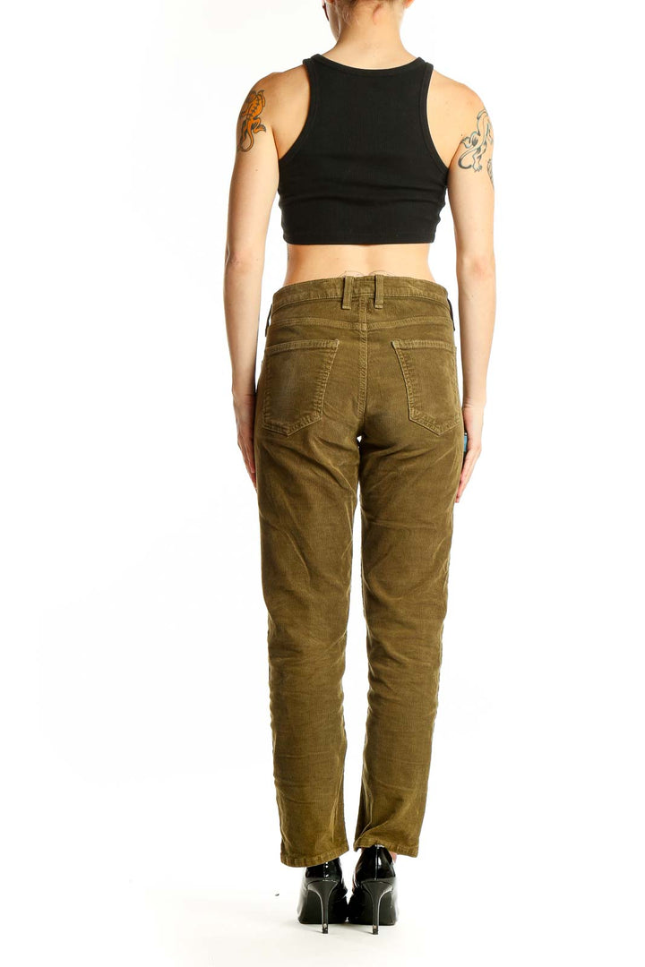Side view of woman wearing olive green corduroy pants by C/E Current/Elliott