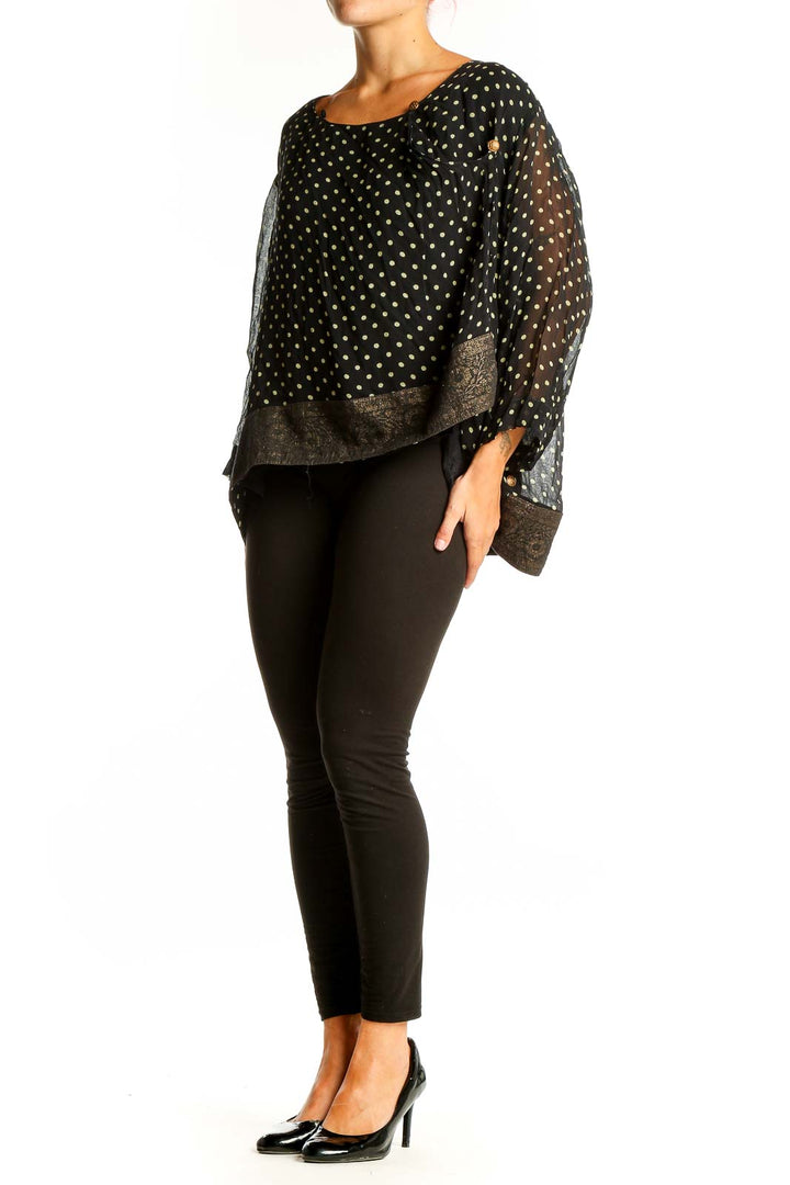 Front view of April Cornell black rayon blouse with yellow polka dots and gold paisley border