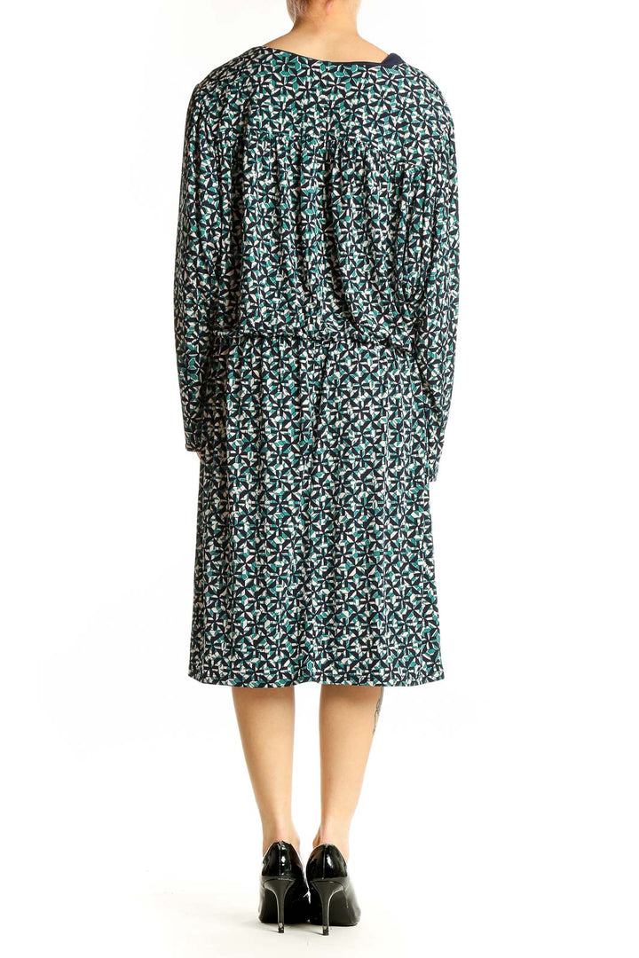 Side view of London Times green floral print V-neck midi dress
