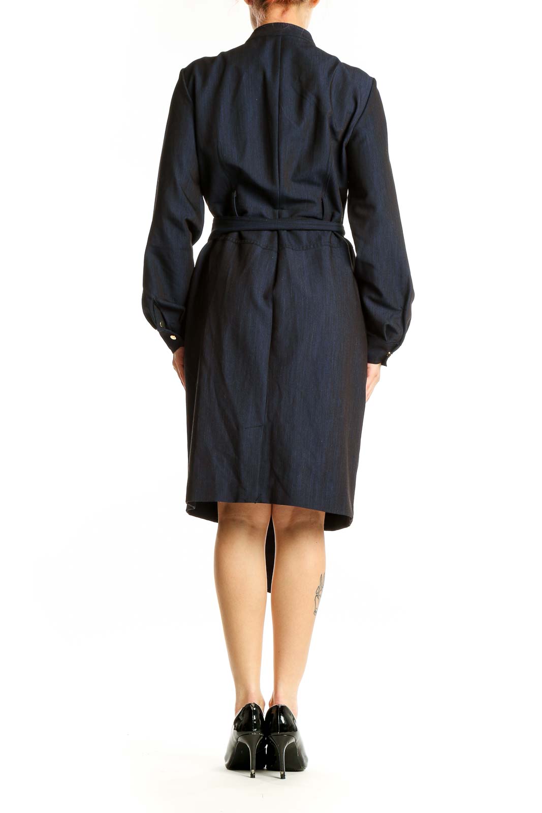 Side view of navy Calvin Klein belted shirt dress showing silhouette
