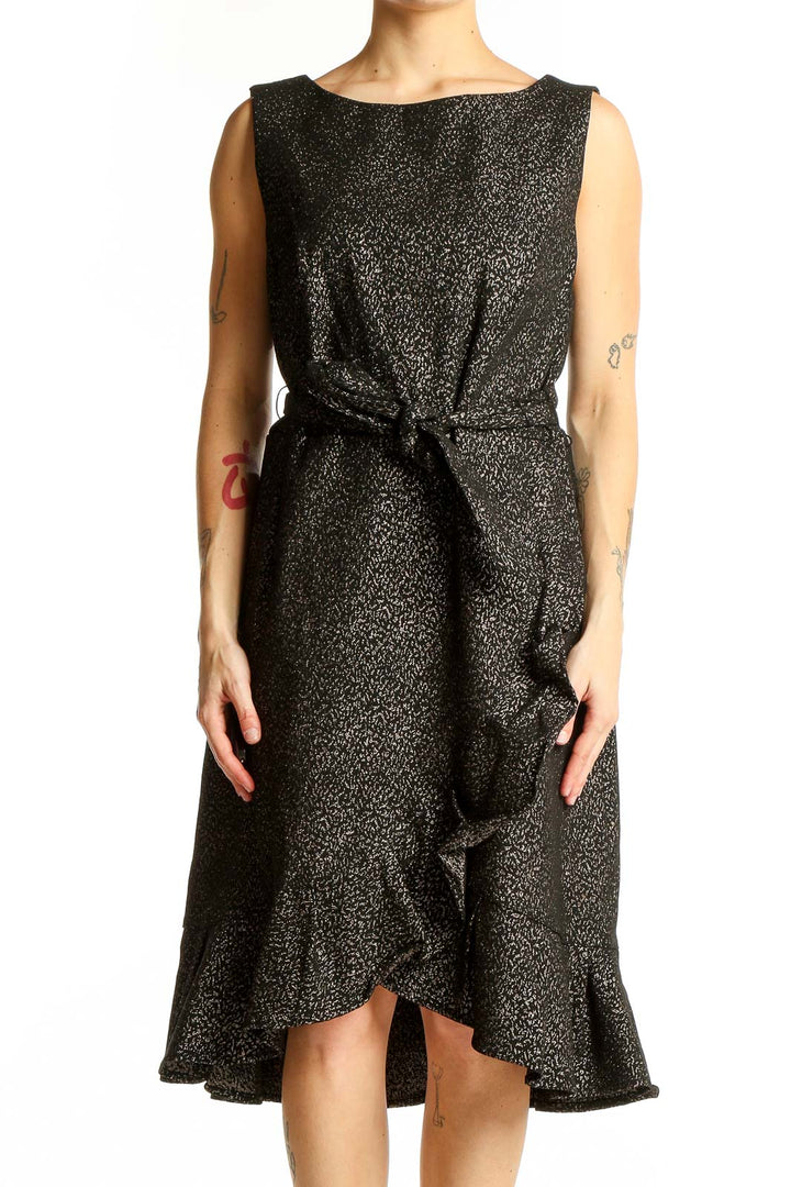 Front view of Calvin Klein black metallic ruffle wrap dress with tie waist