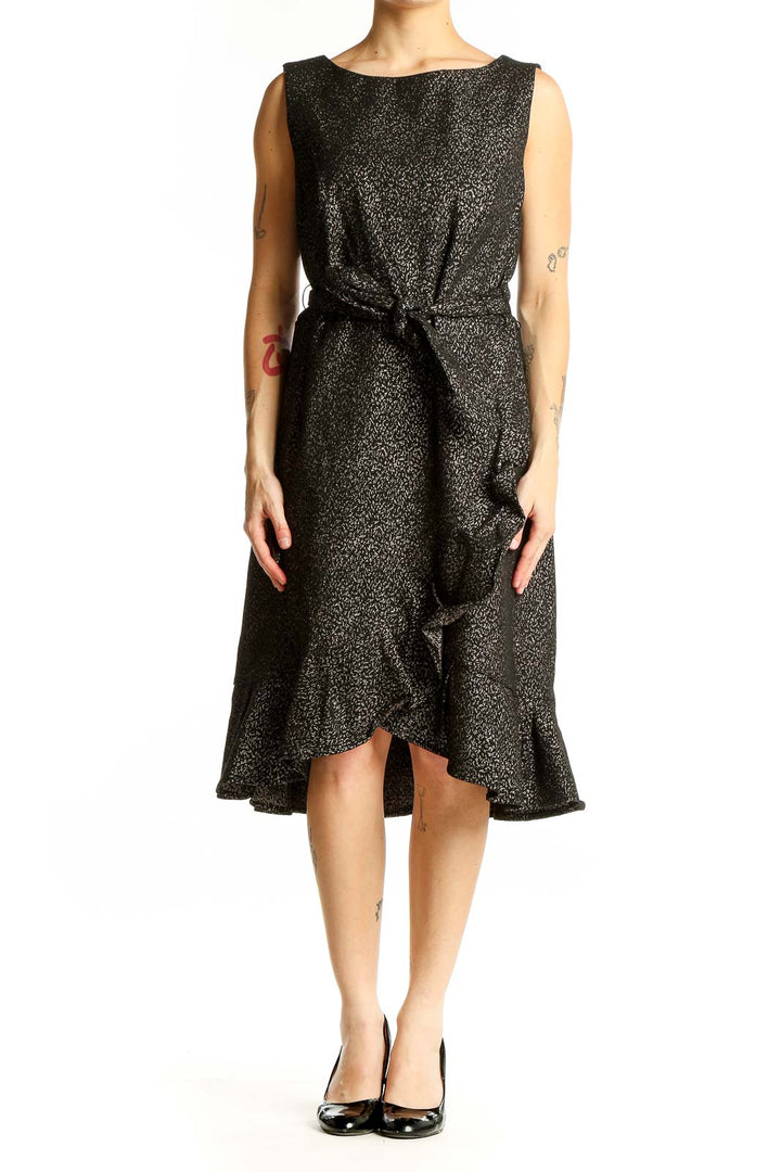 Front view of Calvin Klein black metallic ruffle wrap dress with tie waist