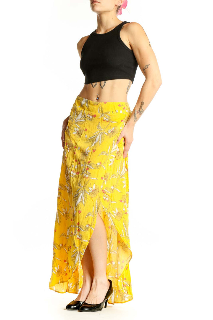 Front view of yellow floral rayon maxi skirt with high-low hemline